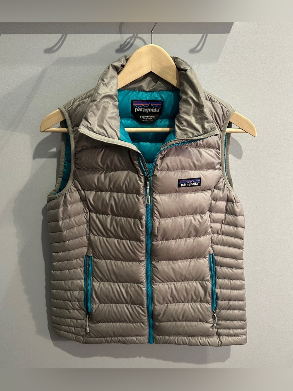 Patagonia Women's Down Vest in Light Gray with Teal Accents
